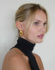 Twisted hoop statement earrings in gold or silver